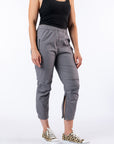 Model wearing Mineral Casual Zip Pants with open ankle zipper