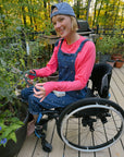 Cienna Ditri in Sunset Raglan Arm Zip Access LS Tee outside in garden