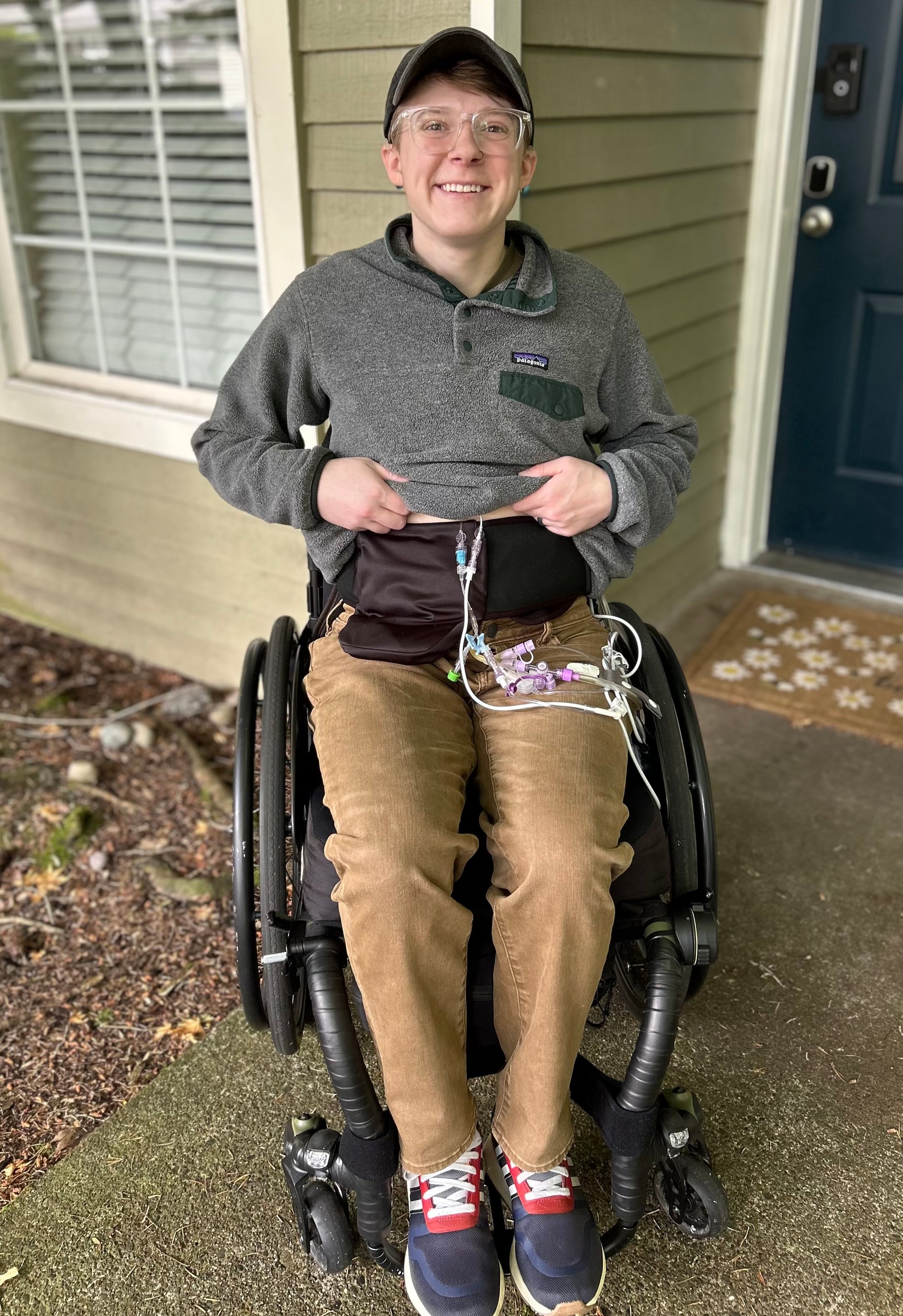 Man in wheelchair wearing Elastic Ostomy Wrap Support Belt
