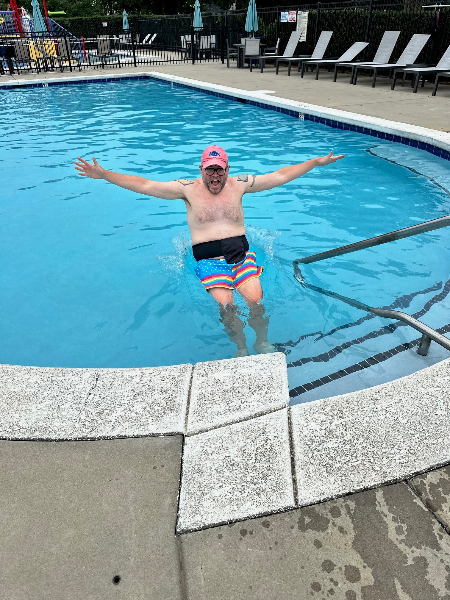 Man in pool wearing Elastic Ostomy Wrap Support belt