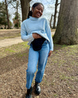 Woman standing outside in elastic ostomy wrap support belt