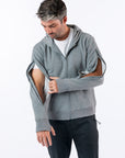 Man showing both open arm zippers on both sides of Full Zip Hoodie