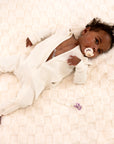 Baby in Vintage White Rib G-Tube Pajamas with G-Tube showing