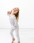 Girl in leopard print gtube pajamas
