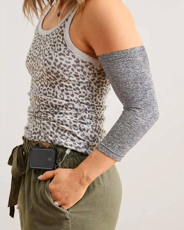 Female model wearing gray Ultra Support Sleeve on arm