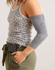 Female model wearing gray Ultra Support Sleeve on arm