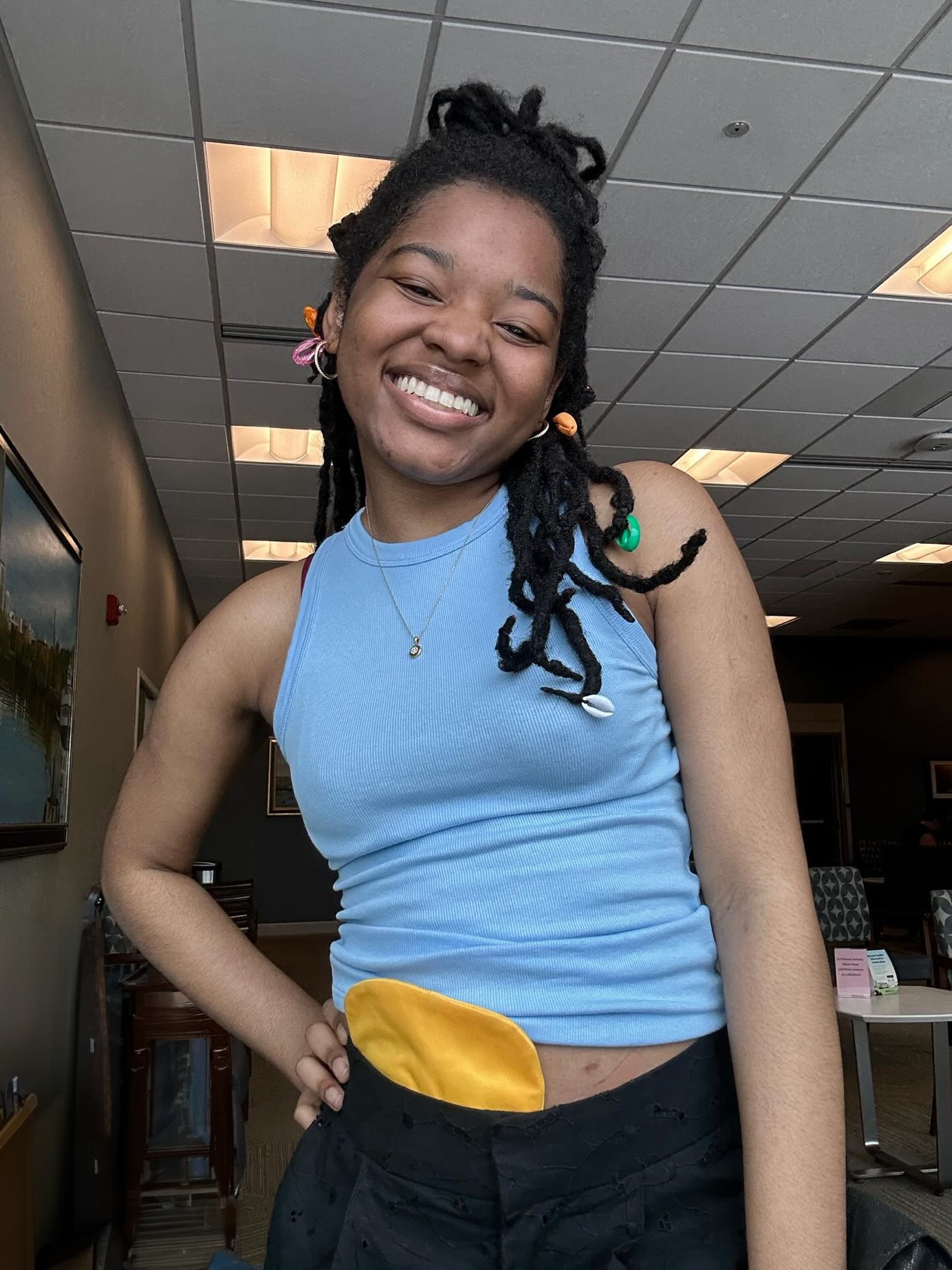 Woman wearing Gold Elastic Ostomy Bag Cover