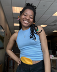 Woman wearing Gold Elastic Ostomy Bag Cover