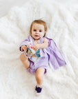 Girl wearing long sleeve lavender all access bodysuit