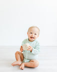 Boy wearing longsleeve mint all access bodysuit
