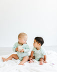 two boys wearing longsleeve all access bodysuit and side access g-tube bodysuit