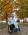 Mason Branstrator wearing Stone Felt Zip Access Shacket and Stone Felt Zip Access Pant in wheelchair