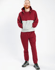 Man wearing Crimson Colorblock Hoodie and Fleece Zip Pants