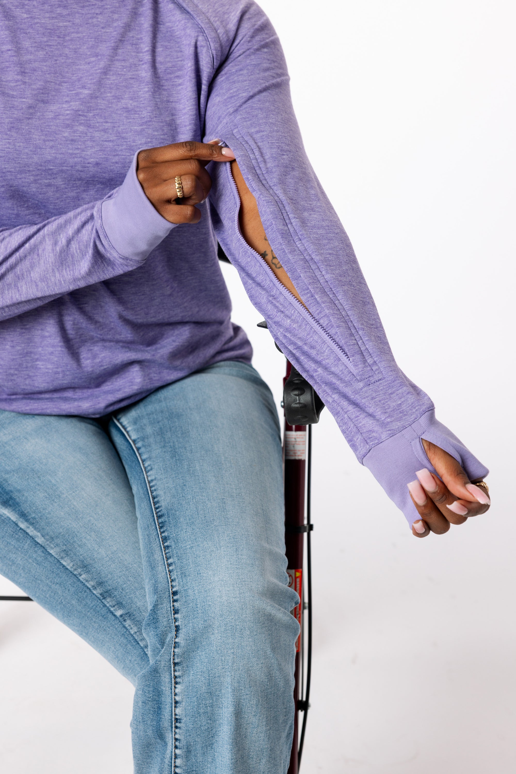 Denisha demonstrating how to open sleeve zipper
