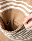 Spoonie Signature Pocket showing device storage and snap closure to stomach