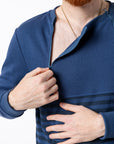 Mike opening chest zipper