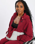 Denisha wearing Crimson Colorblock Hoodie and Fleece Zip Pants 5'5" wearing a size XS