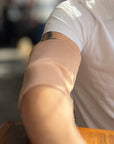 Man wearing tan support sleeve
