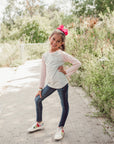 Girl wearing pink Kids Raglan Access Tee