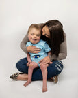Boy in blue Tummy Access Bodysuit with G-Tube Pad