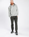 Man wearing gray Adult Chest & Abdomen Zipper Access Hoodie