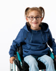 Gracie in wheelchair wearing Navy Zipper Access Hoodie