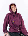 Woman smiling with hood over head