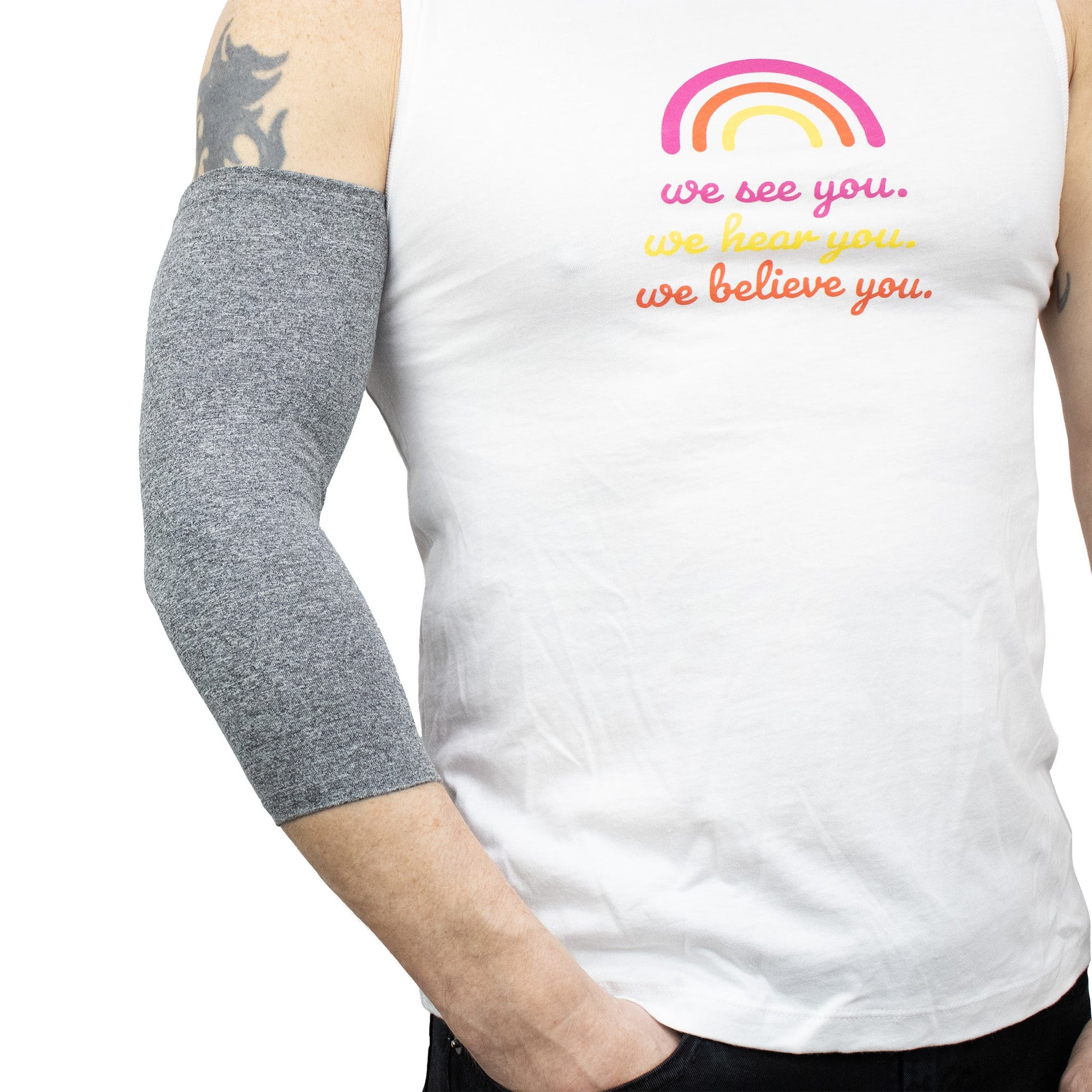 Male model wearing gray Ultra Support Sleeve on arm