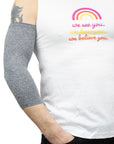 Male model wearing gray Ultra Support Sleeve on arm