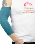 Male model wearing Teal Ultra Support Sleeve on arm