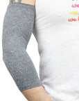 Male model wearing gray Ultra Support Sleeve on arm