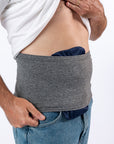 Closeup of Steel stretch waistband covering navy ostomy bag cover