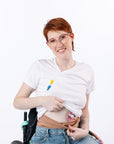 Woman wearing Tan stretch waistband, showing pink G-Tube Pad