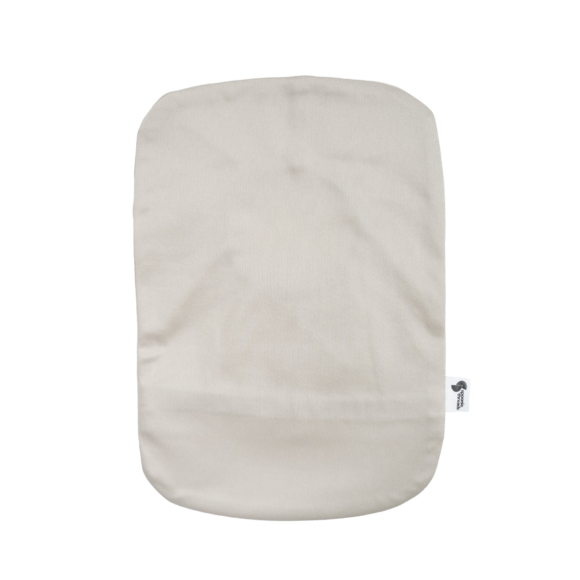 Flat of back of Beige elastic ostomy bag cover