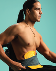 Man wearing Gold Elastic Ostomy bag cover under teal stretch waistband