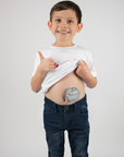 Boy wearing gray g-tube pad