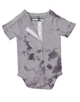 Flat of all access bodysuit with open snaps