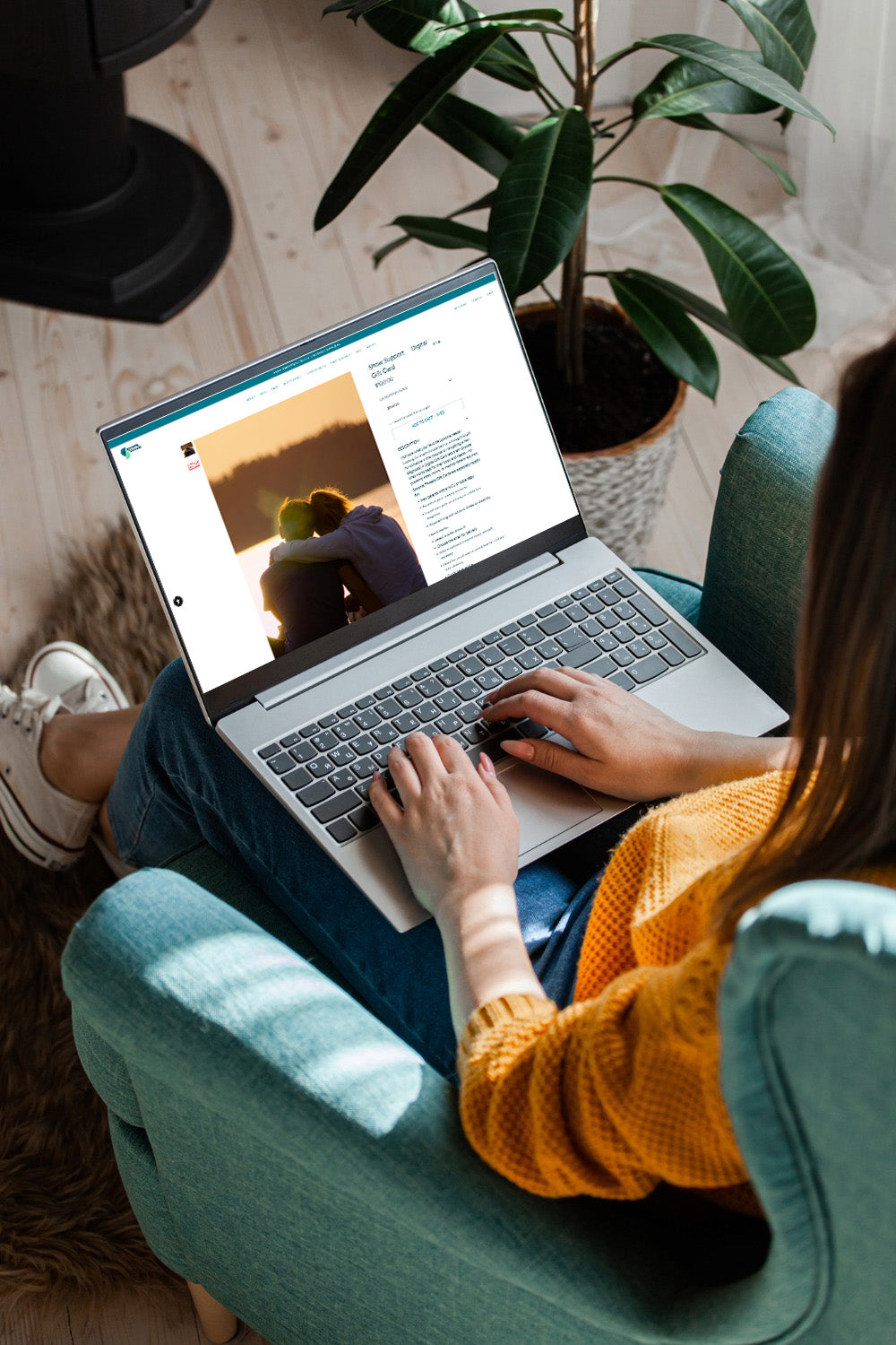 Person using a laptop to purchase gift card