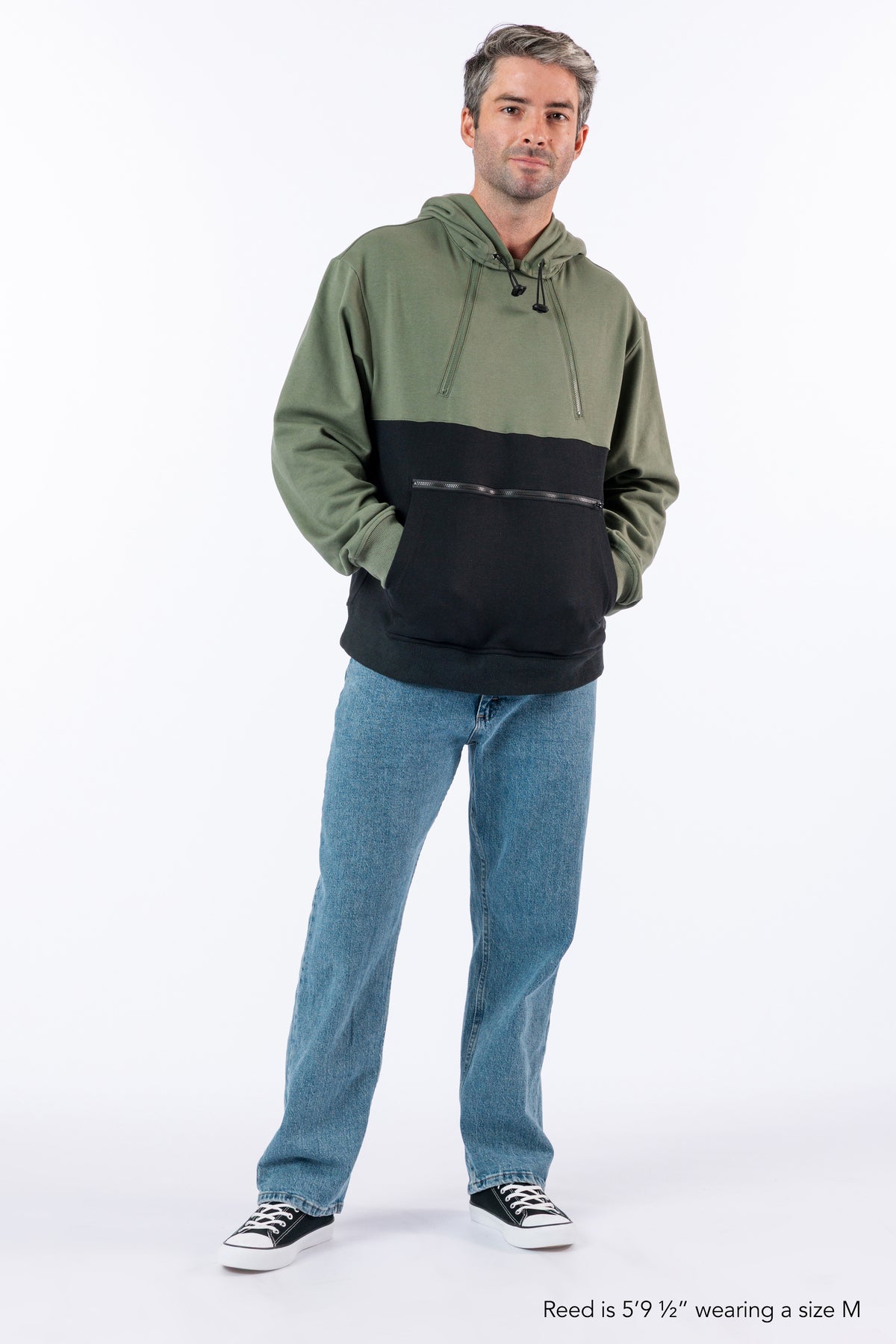 Man wearing Sage colorblock hoodie against white background. Text reads "Reed is 5'9 1/2" wearing a size M".