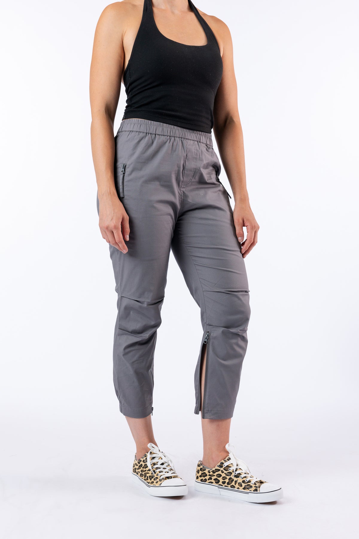 Model wearing Mineral Casual Zip Pants with open ankle zipper
