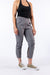 Model wearing Mineral Casual Zip Pants with open ankle zipper