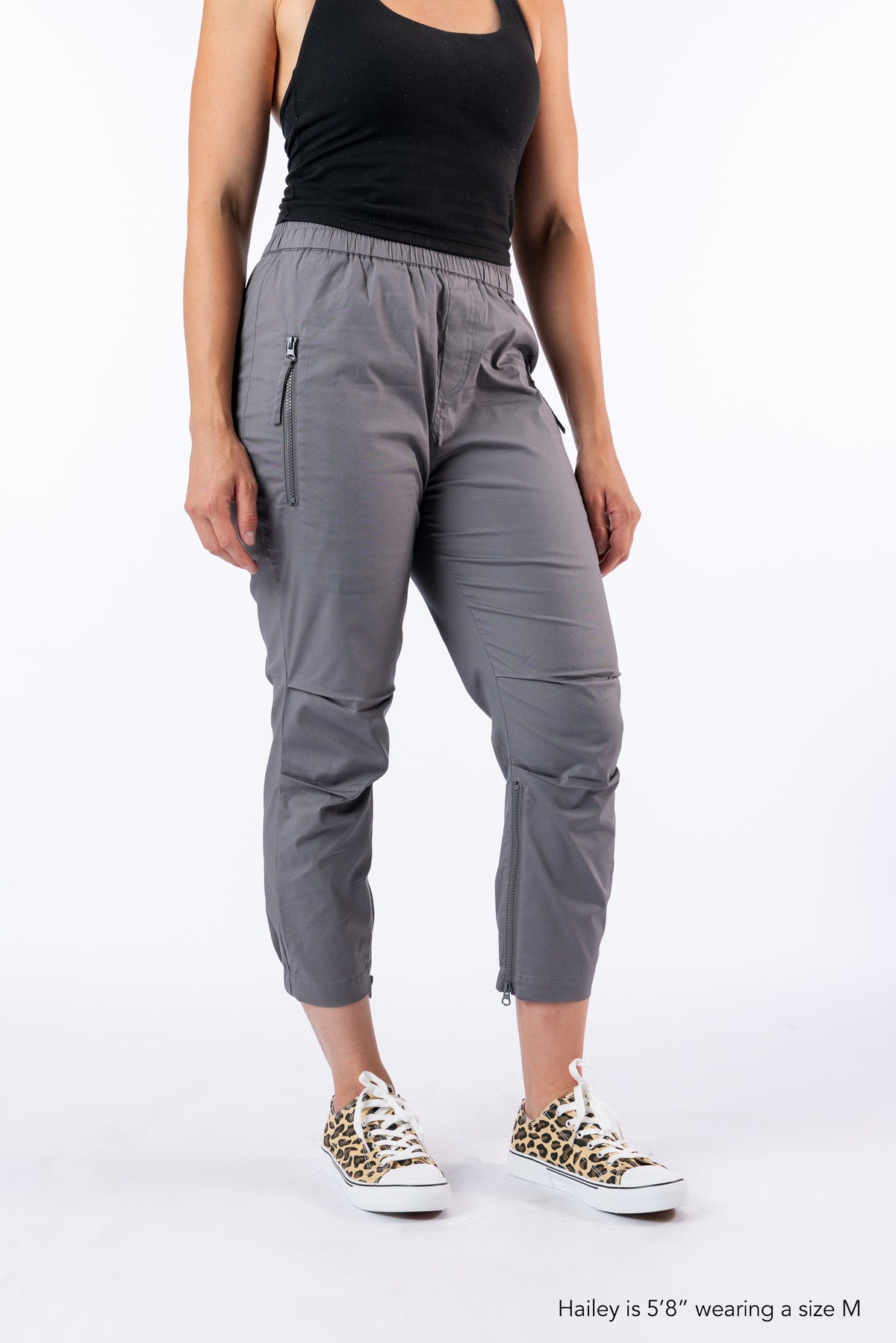 Model wearing Mineral Casual Zip Pants. Text at the bottom right reads 'Hailey is 5'8" wearing a size M'.