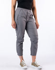 Model wearing Mineral Casual Zip Pants. Text at the bottom right reads 'Hailey is 5'8" wearing a size M'.