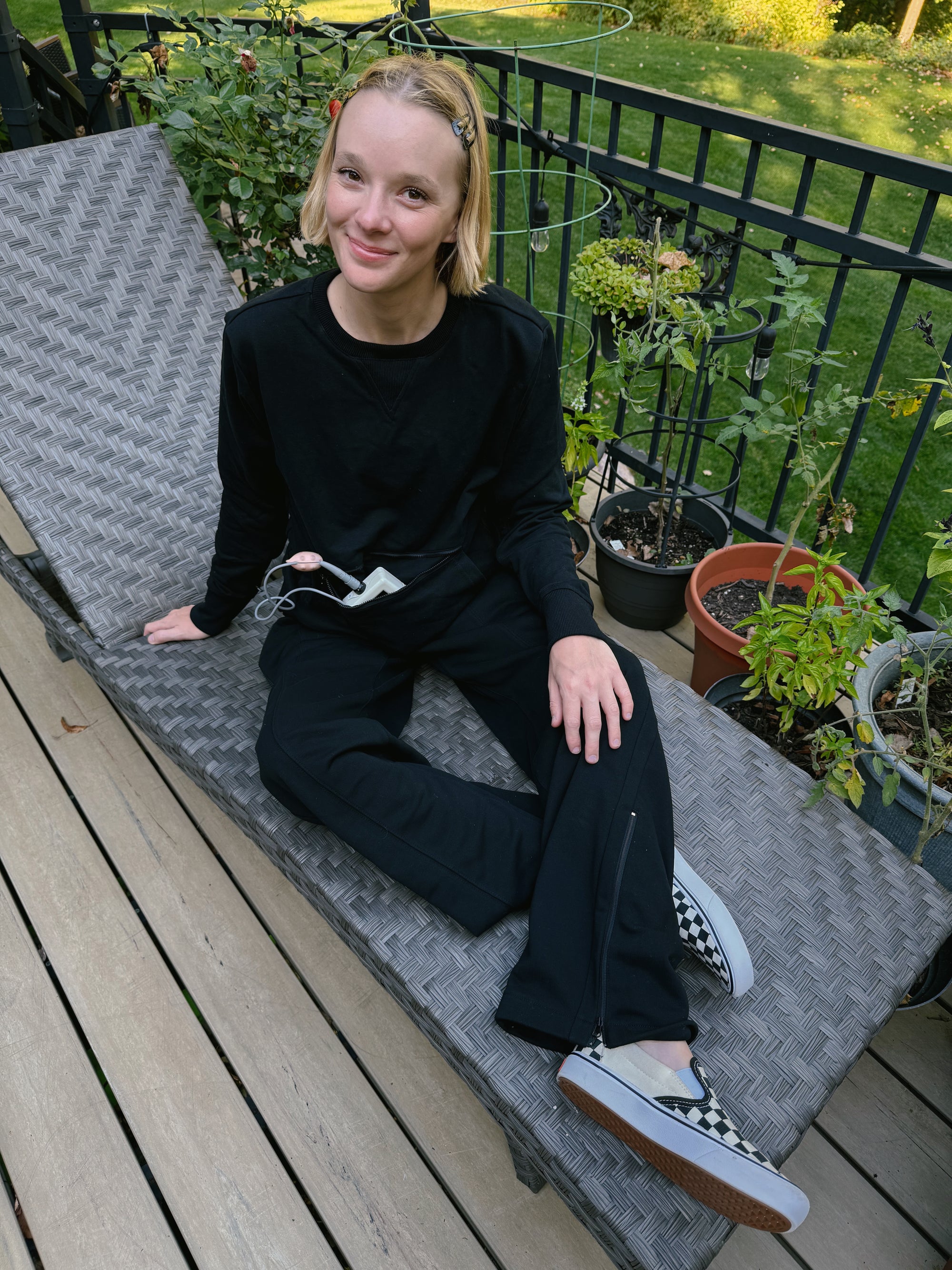 Cienna Ditri in Zip Access Crew Sweatshirt, showcasing device storage