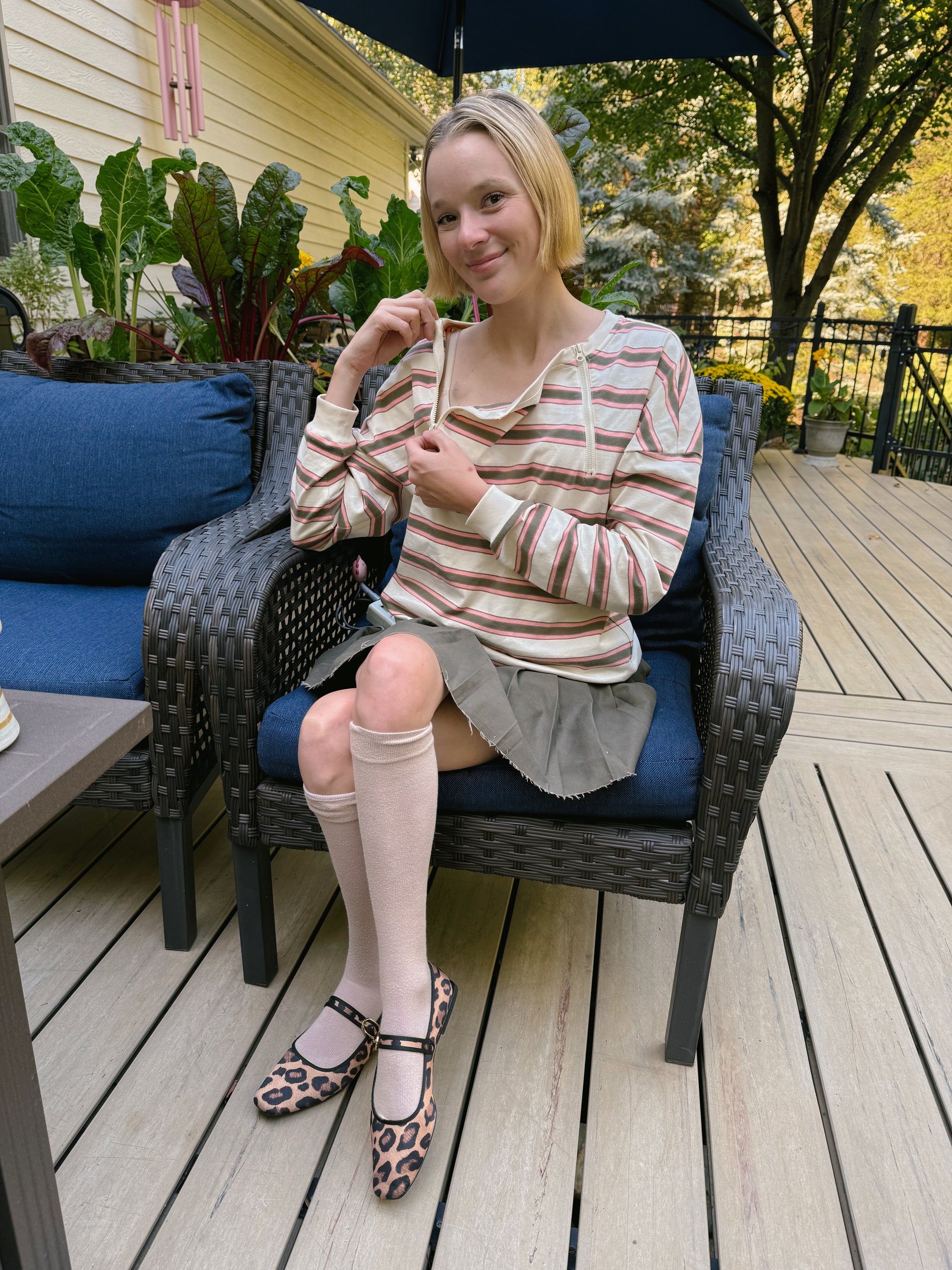 Cienna Ditri in Yarn dye Zip Chest Access Tee, showing chest zippers