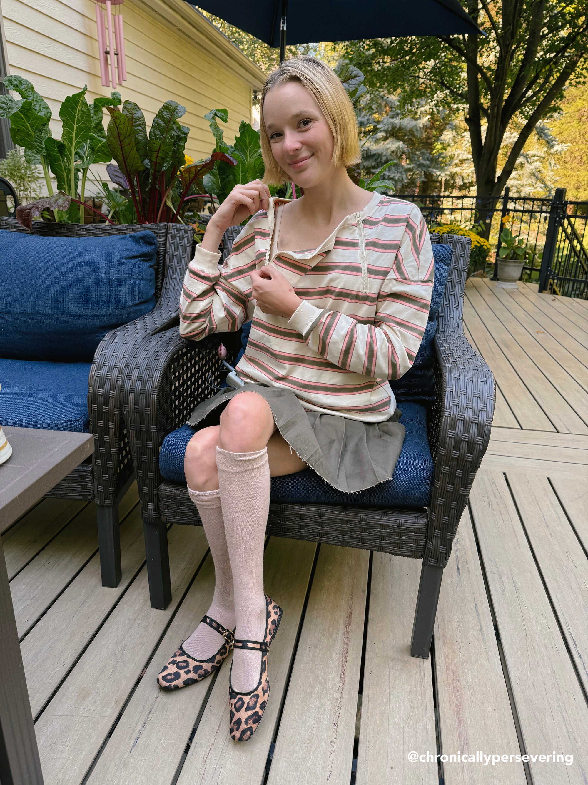 Cienna Ditri @chronicallypersevering in Yarn dye Zip Chest Access Tee, showing chest zippers