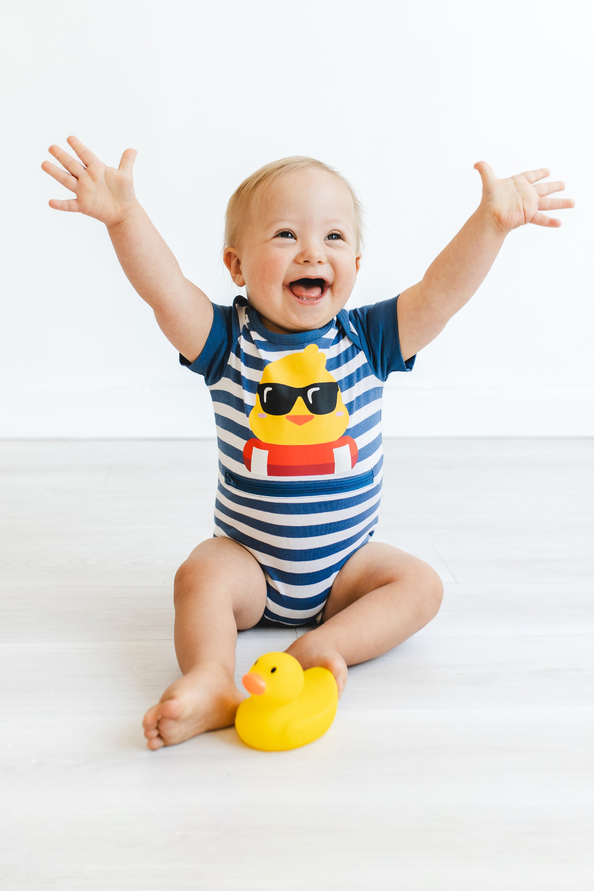 Boy in duckie Tummy Zip Bodysuit