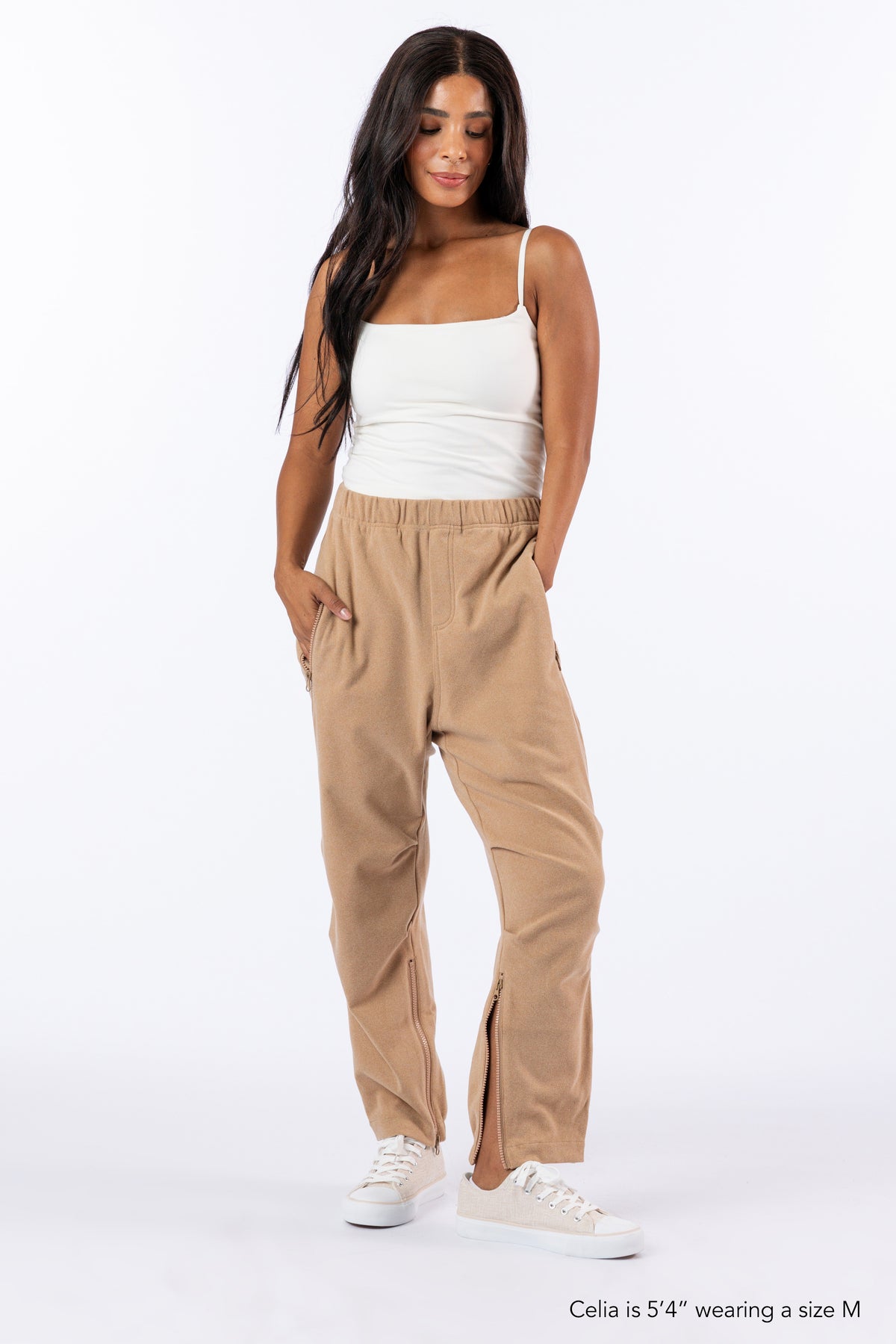 Woman wearing Khaki Felt Zip Access Pants with undone ankle zipper