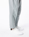 Closeup of person wearing Stone Felt Zip Access Pant