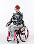 Woman in wheelchair wearing Denim Shacket unzipping arm zipper